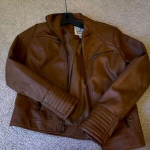 A soft synthetic leather jacket, and very comfortable for the cool weather